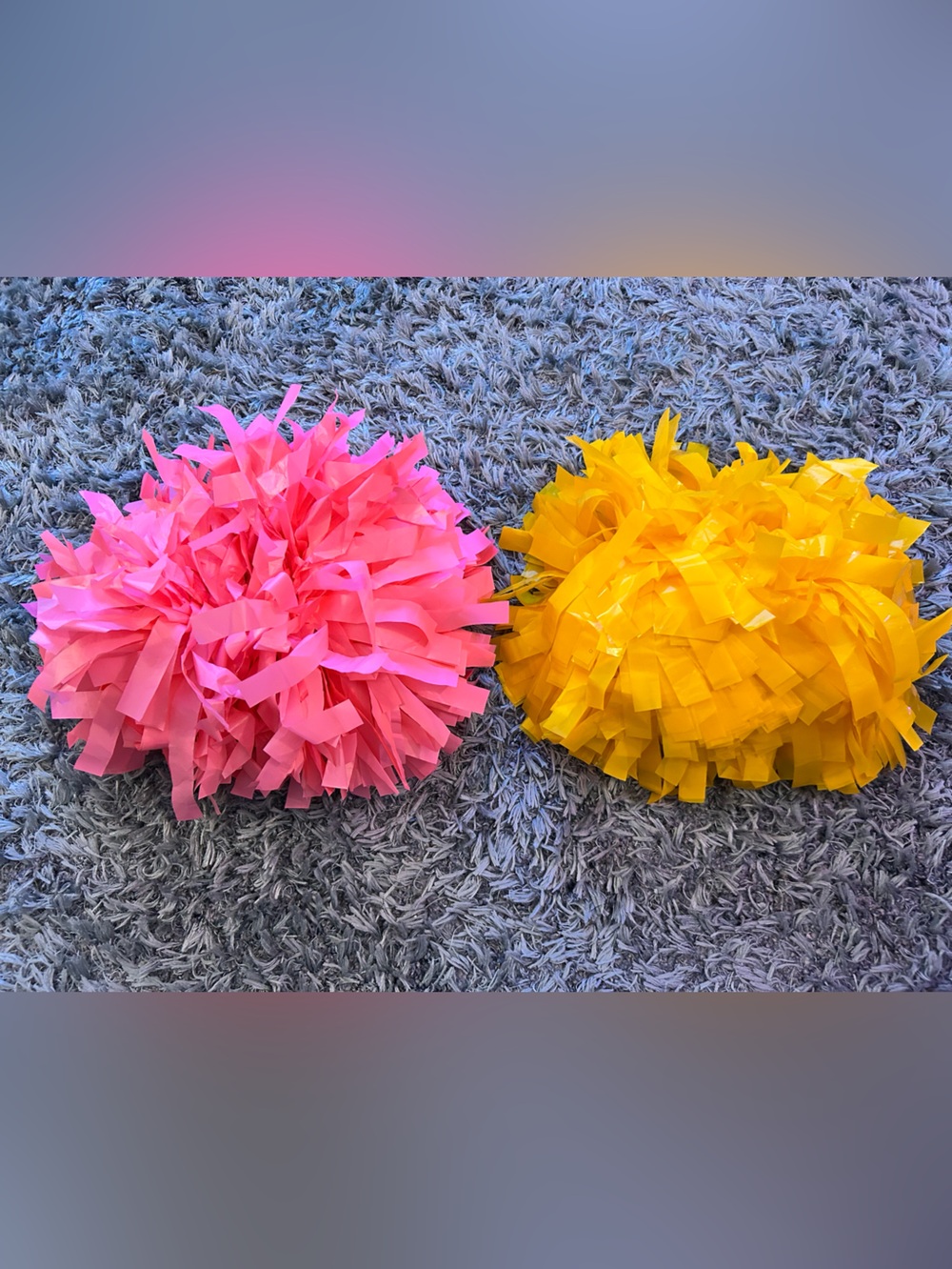 Brand New Pink and Yellow Plastic Poms Poms